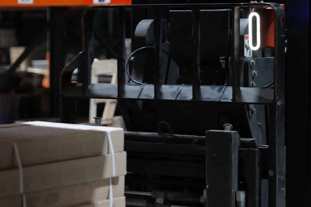 Corvus Trident mounted on a forklift in a live warehouse environment