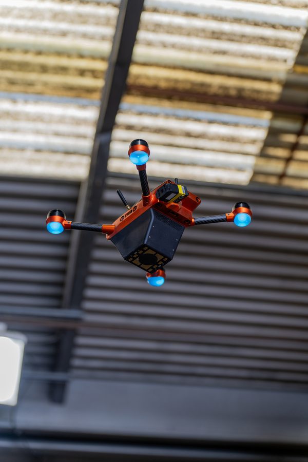 Corvus One autonomous drone performing inventory cycle count in warehouse aisle