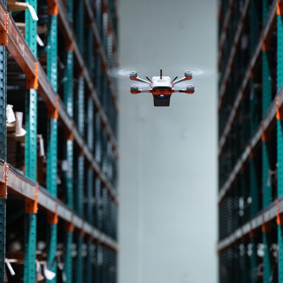 A Corvus One autonomous inventory drone scans cable reels in an aisle at LAPP USA's Brownsburg, Indiana distribution center