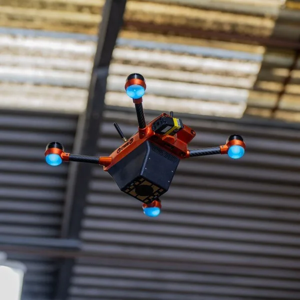A Corvus One autonomous inventory drone scans high-bay racking at an MSI Surfaces distribution center, capturing pallet-level inventory data on flooring, countertop, and hardscaping materials