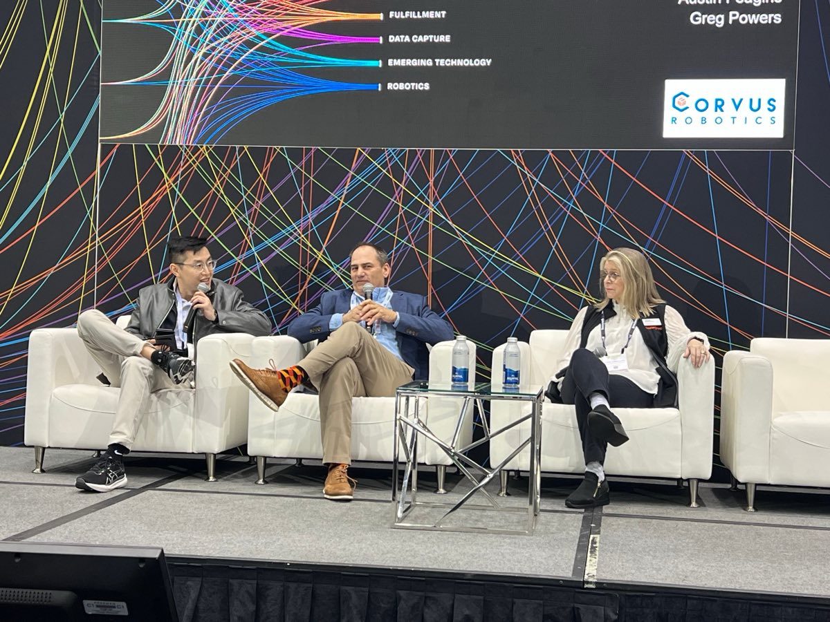 Jackie Wu of Corvus Robotics, Greg Powers of Gray AES and Steph Hobley-Lloyd of Honeywell on stage at ProMat 2025